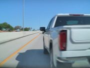 Insane driver gets his ego hurt after a Tesla driver changes lanes in front of him. Strikes back and almost causes his own accident.