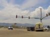 Shuttle bus driver on Mulberry in Ft. Collins blows red light, t-bones turner towing a utility trailer.