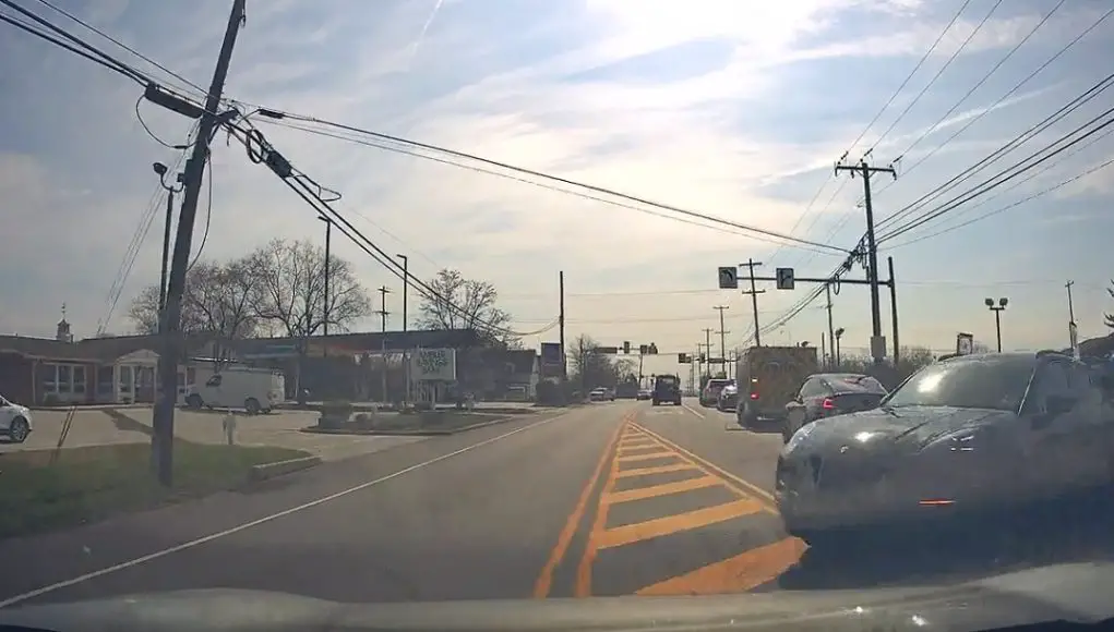Dashcammer drives through painted median and immediately regrets it after crashing into Porsche.