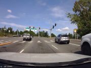 Tacoma driver blows through red light on SR-522 overpass, only to get stuck anyway.
