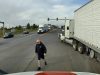 Road raging semi truck driver in the wrong dangerously passes fellow semi driver to confront them despite being in the wrong.