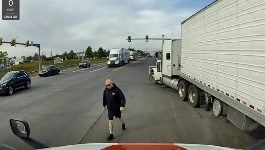 Road raging semi truck driver in the wrong dangerously passes fellow semi driver to confront them despite being in the wrong.