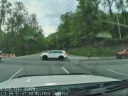 Driver exiting Gatlinburg Welcome Center pulls out into US-441 intersection at the worst possible time. Almost causes her own T-bone accident.