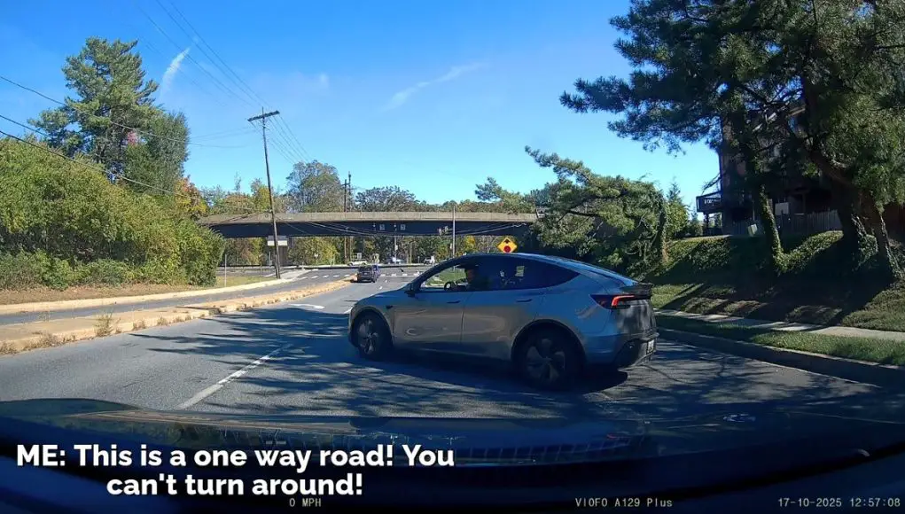 Clueless and plain bad Tesla driver attempts to make a turn to head the other way down the one way Grosvenor Lane.