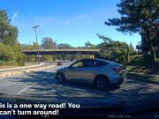 Clueless and plain bad Tesla driver attempts to make a turn to head the other way down the one way Grosvenor Lane.