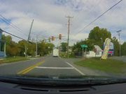 Camper Van nearly runs red light at US-11 and Hatchery Rd. setting up dash cam owner for potential accident, but saved by safe following distance.