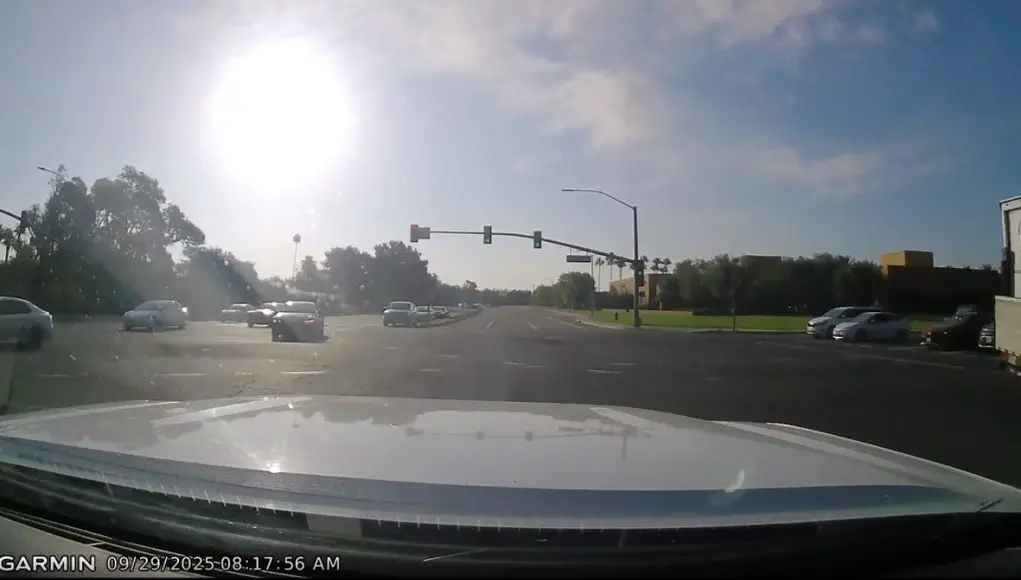 Driver on Jamboree and Irvine assumes they've got the green despite not being able to see the turn signal. Almost collide with dashcam owner with green light.