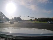 Driver on Jamboree and Irvine assumes they've got the green despite not being able to see the turn signal. Almost collide with dashcam owner with green light.