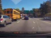 Distracted driver rear ends school bus on the Vine Street Expressway/95 causing thousands in damage to at least one vehicle.