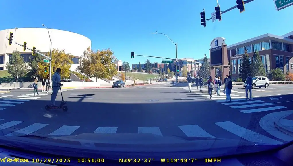 Reno NV man on scooter running red light-C Ignorant scooter rider coasts through W 15th and Virginia disregarding red light.