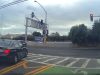 Driver at Pulgas and East Bay Shore pulls off insane move, driving against traffic and over double solid yellow to run red.