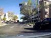 Red light runner on lead and cedar fails to yield before turning, almost collides with dashcam owner.