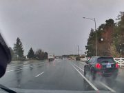 Crazy Fiat driver uses bike lane on rain-soaked Stead Blvd to overtake dashcam owner.