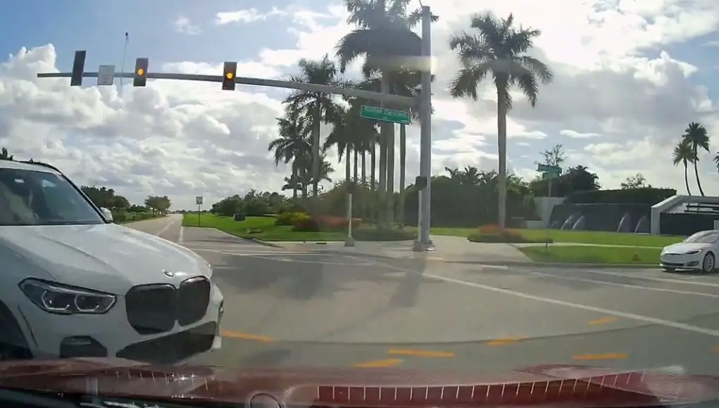 Turning driver with yellow fails to yield the right of way. Crashes and inadvertently incriminates themselves on dashcam.