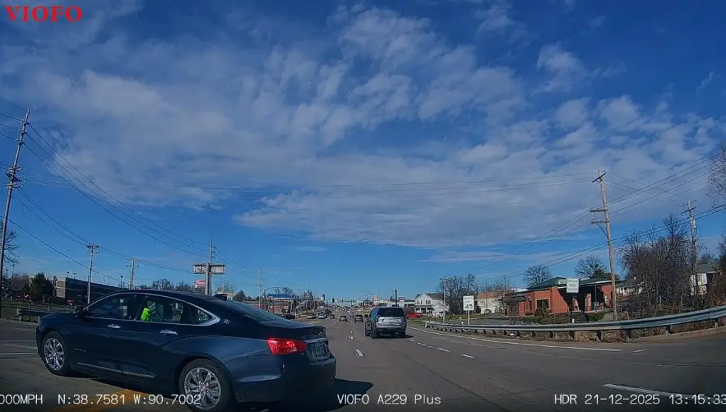 Driver in Impala does illegal left turn. Has the nerve to throw an obscene gesture twice in retaliation.