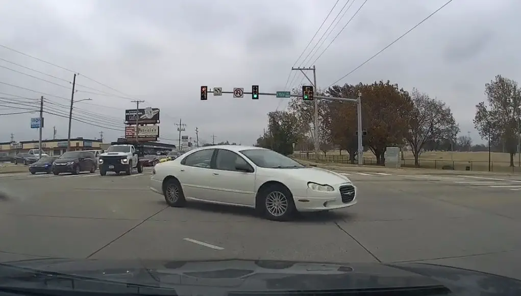 Red light runner Tulsa Driver turning across S Yale Ave tries to run red light that's already been on for 4-seconds, almost gets t-boned by dashcam owner.