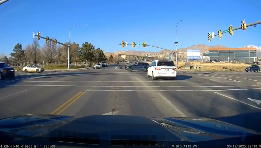 Red light runner in Lehi UT Extremely late red light runner at Ashton and Triumph narrowly avoids one nasty t-bone collision by mere inches.
