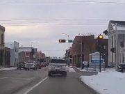 Oshkosh, WI: Red Light Run at 6th & Oregon Turns Dangerous as Driver Blasts Through Signal At Least 10 Seconds After Turning Red Extreme red light runner in Oshkosh enters intersection at least 10 seconds after their light turned red.