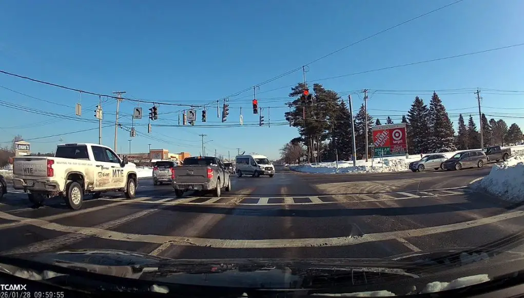 Saratoga Springs, NY: Driver Distracted at Route 50 & Old Gick Almost Smashes Through Red, Saved By Dashcam Owner Honking & Looking Up Distracted driver on Route 50 and Old Gick mistakes drivers next to them turning as his turn to go. Almost causes red light crash.