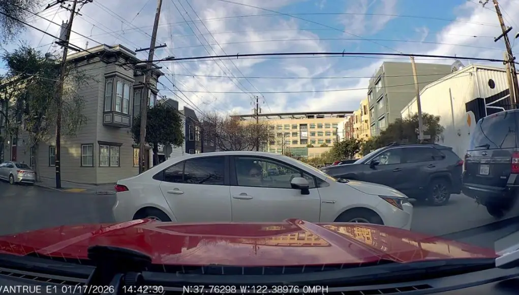 Tennessee and 18th in SF-C Ignorant driver in SF on Tennessee and 18th block 4-way stop, passenger flips off dashcam owner.