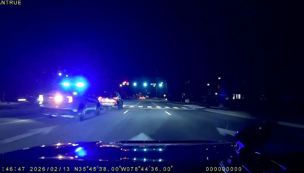 Ignorant driver on Walnut St. cuts off Cary Cop then brakes & stops in front of them against a green light.
