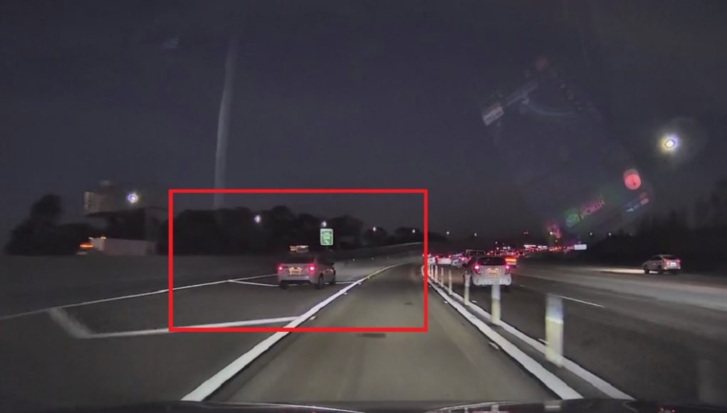 Corolla going through 405 gore point Reckless driver threads the needle, heads through gore point towards 405/605 barrier so they don't miss their exit.