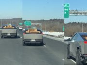 Cybertruck owner caught on the 91 with unsecured load held in place with pack of water.