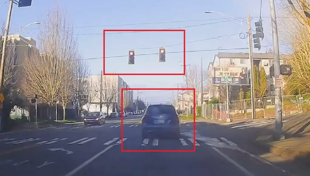 Impatient driver at Greenwood and N 90th can't be bothered to wait for a red light, runs it after 10 seconds.