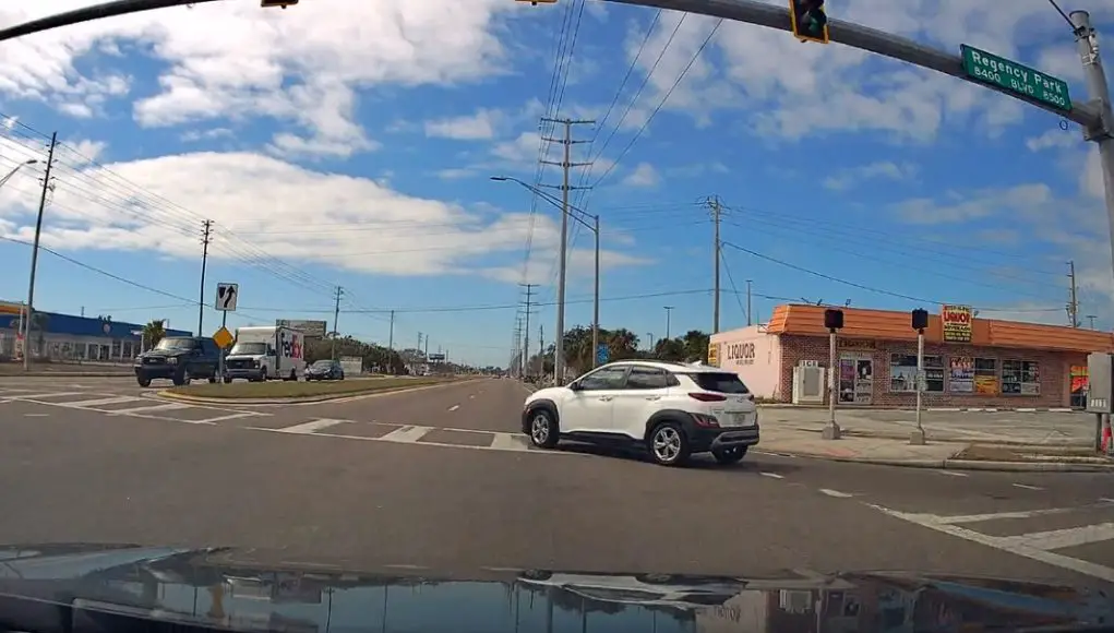 Careless driver merging onto Ridge from Regency Park fails to yield. Almost rear-ended by fast approaching dashcam owner with right of way.