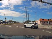 Careless driver merging onto Ridge from Regency Park fails to yield. Almost rear-ended by fast approaching dashcam owner with right of way.