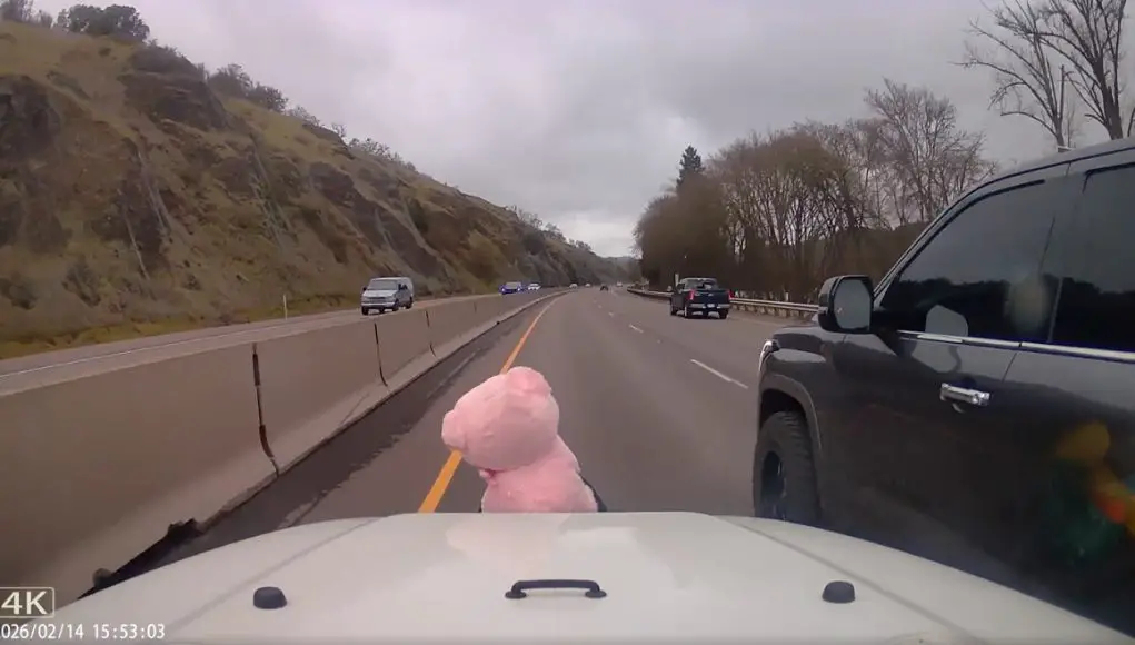 Toyota Tundra driver merging onto I-5 from Frontage Rd. doesn't like, nearly crushes dashcam owner into median barrier.