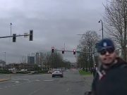 Tukwila, WA: Clueless Driver on Strander Near Westfield Southcenter Blows Red Light Leaving Pedestrian Shaking Their Head Red light runner on Strander near Westfield Southcenter blows through intersection, leaves pedestrian shaking their head.