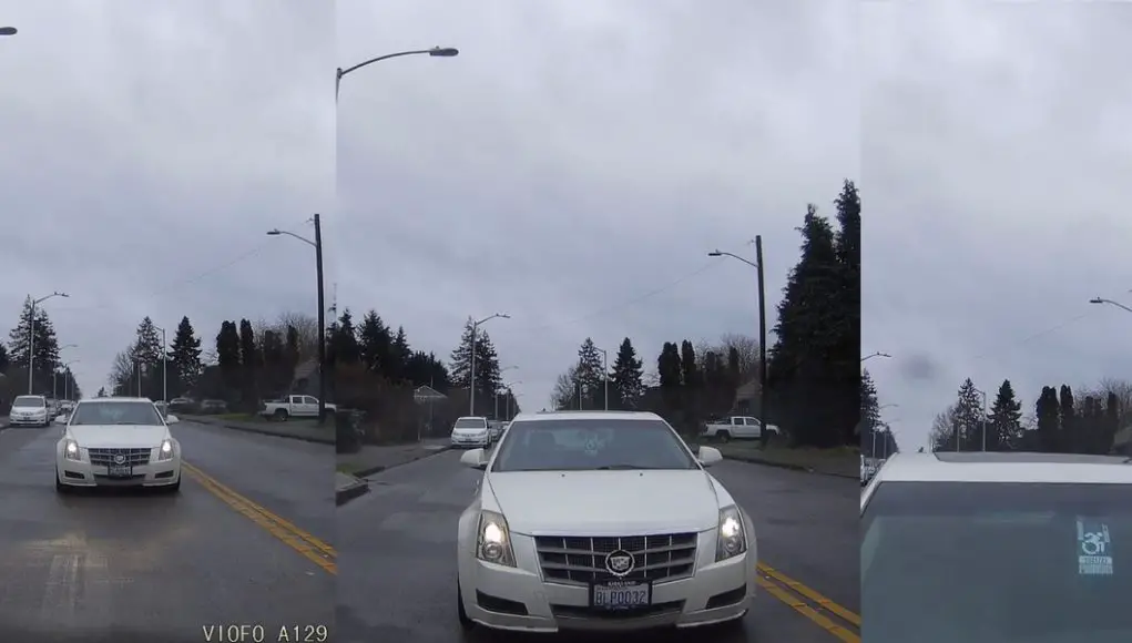 Distracted, disabled, and uninsured driver caught on dashcam rear ending the back of vehicle and then claiming it was green when, in fact, it wasn't.