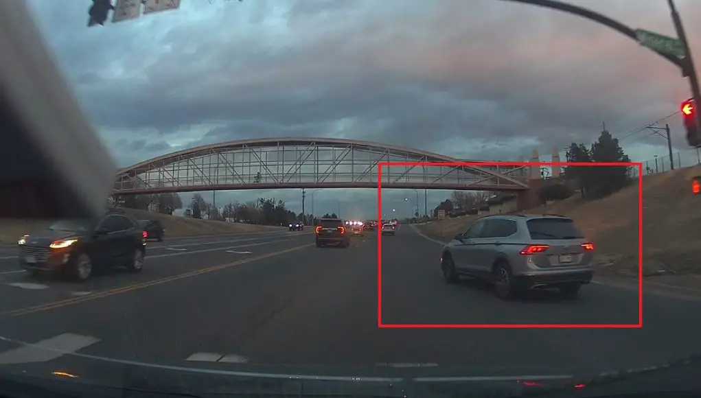 Right-on-red turner at Mineral and Santa Fe makes turn a little too wide. Nearly gets into collision with approaching dashcam owner.