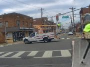 Utility worker spotted on dashcam going down Valley Brook in the bucket of a bucket truck.