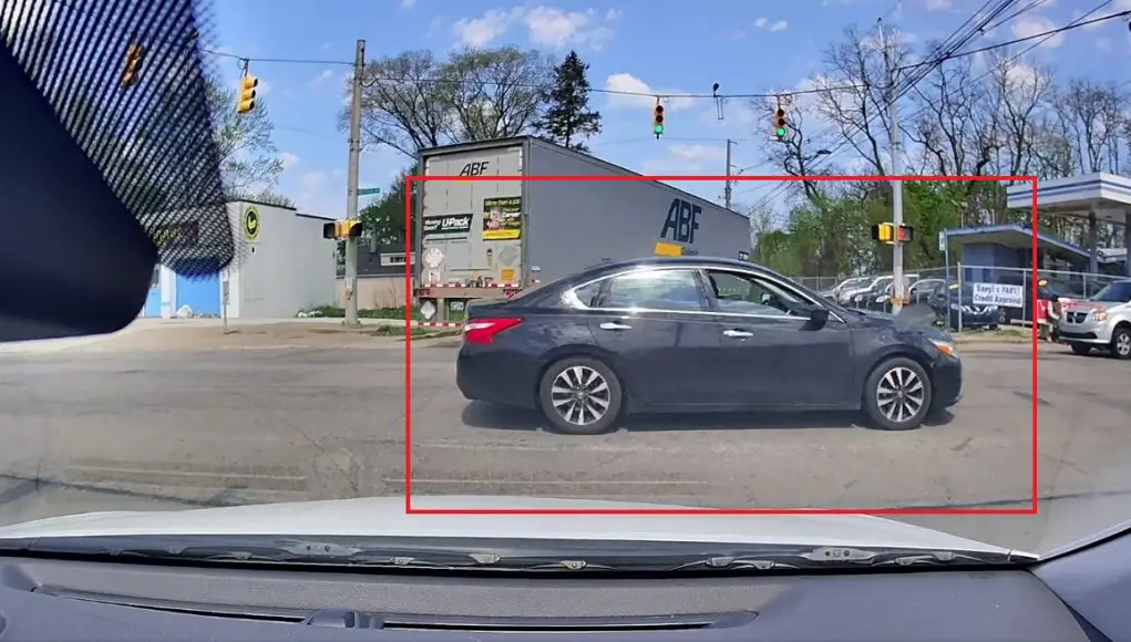 Altima driver takes advantage of dashcam owner's yielding, uses semi as an excuse to run a red.