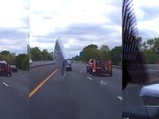 Unsecured mattress comes flying out of utility trailer onto I-295, barely missing dashcam owner's car.