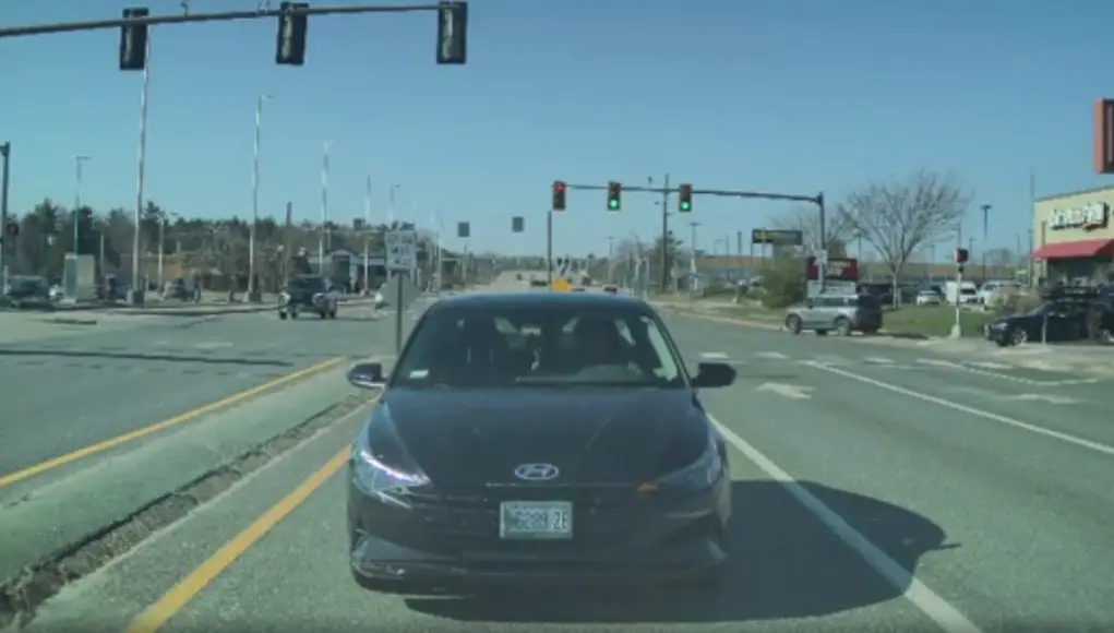 Driver slotting into a left turn lane on Maine Mall Rd decides, for some reason, to go straight, towards a dashcammer, instead.