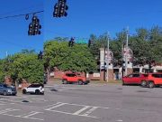 Jeep driver frustrated that driver in front of them is not moving, risks accident running red light instead.