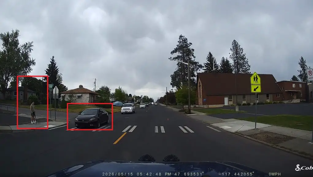 Car after car blows by this pedestrian and his dog waiting at this W Garland Ave crosswalk across Map High.
