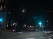 Scooter rider's late red run at Clarendon & Columbus causes driver to emergency brake.