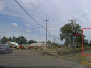 Goofball makes hare brained decision to drive through lowered, flashing crossing arms at the Park St. Railroad Crossing.
