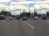 Reckless Tesla driver on the 502 recklessly and needlessly uses emergency shoulder to pass semi, kicks up dust and debris.
