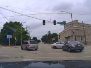 Rockford, ILL: Driver Takes Blind Unprotected Left on Charles & Washington—Narrowly Misses Getting T-Boned by Car With Right of Way Careless driver making unprotected left turn at Charles and Washington nearly gets t-boned.