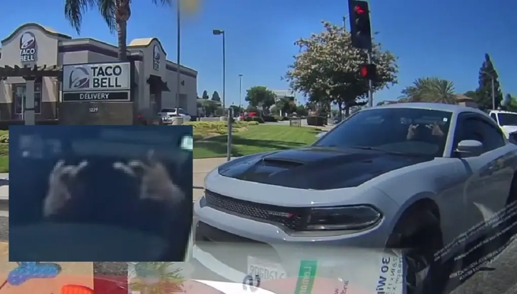 Santa Ana failure to yield right on red Dodge Charger driver on Grand & 17th fails to yield on right on red, almost crashes head-on into dashcam owner making u-turn with right of way.