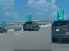 Dashcam owner forced to take evasive maneuver after driver merges without yielding from gore point.