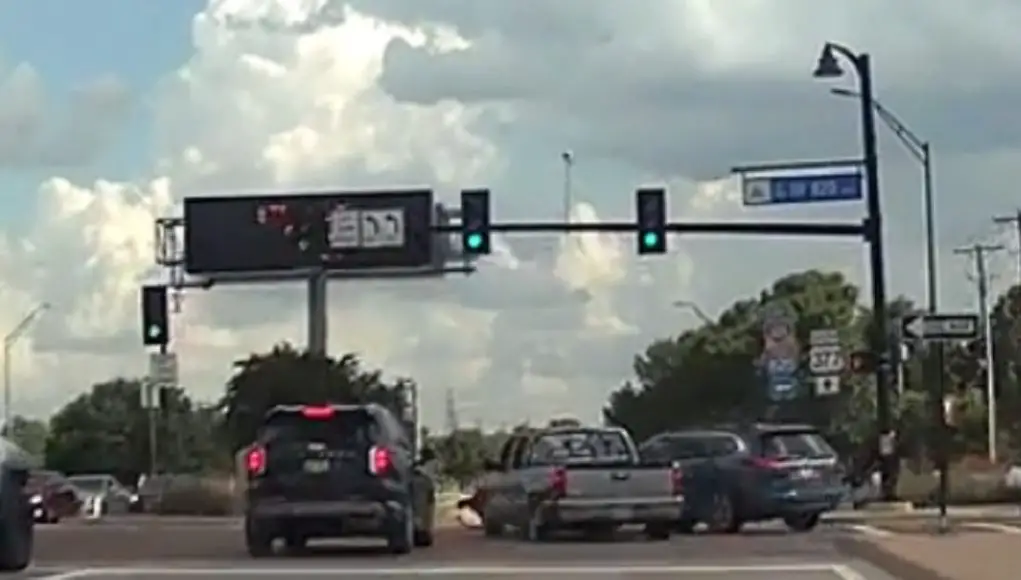 Red light runner at Denton Highway and Loop 820 assumes they had the green, causes fender bender with pickup.