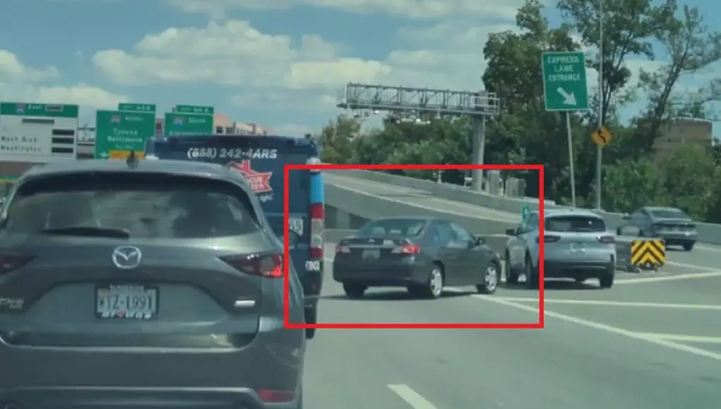 Goofball I-66 driver brings entire interstate to a standstill by forcing express lane lane change through gore zone.