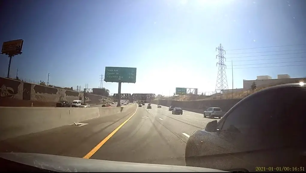 Riverside, CA: Goofball Tesla Driver On The 215 Tries To Cross Entire Freeway Without Looking, Almost Sideswipes Dashcam Owner Bonehead Tesla driver tries to make his way across the entire freeway into the fast lane, without looking.