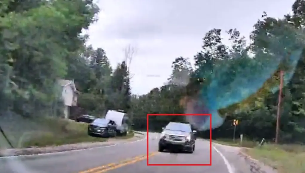 Goofball drives into oncoming traffic on Mitchell Rd Goofball on Mitchell Rd swings wide going around blind corner, nearly collides head-on with pizza delivery driver.